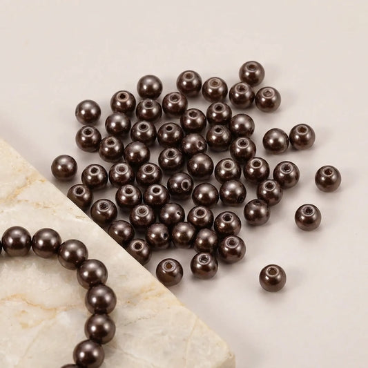 Chocolate glass pearl beads with pearl coating and visible bead holes