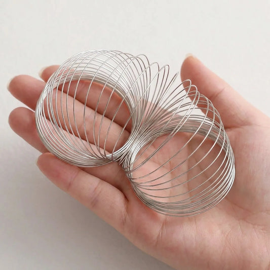 Flexible Memory Steel Wire Bracelet Rings Shown in Hand for Size Reference