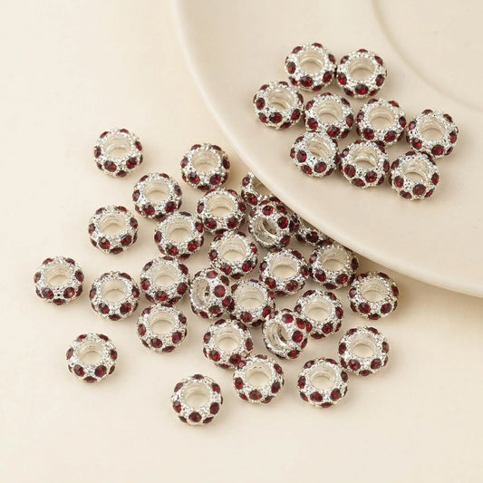 Red rhinestone spacer beads with large holes and silver tone finish