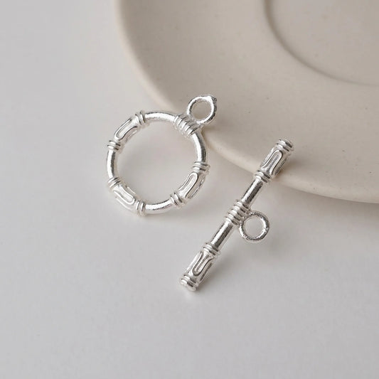 Sterling silver toggle clasp with textured ring and decorative T-bar for jewelry making