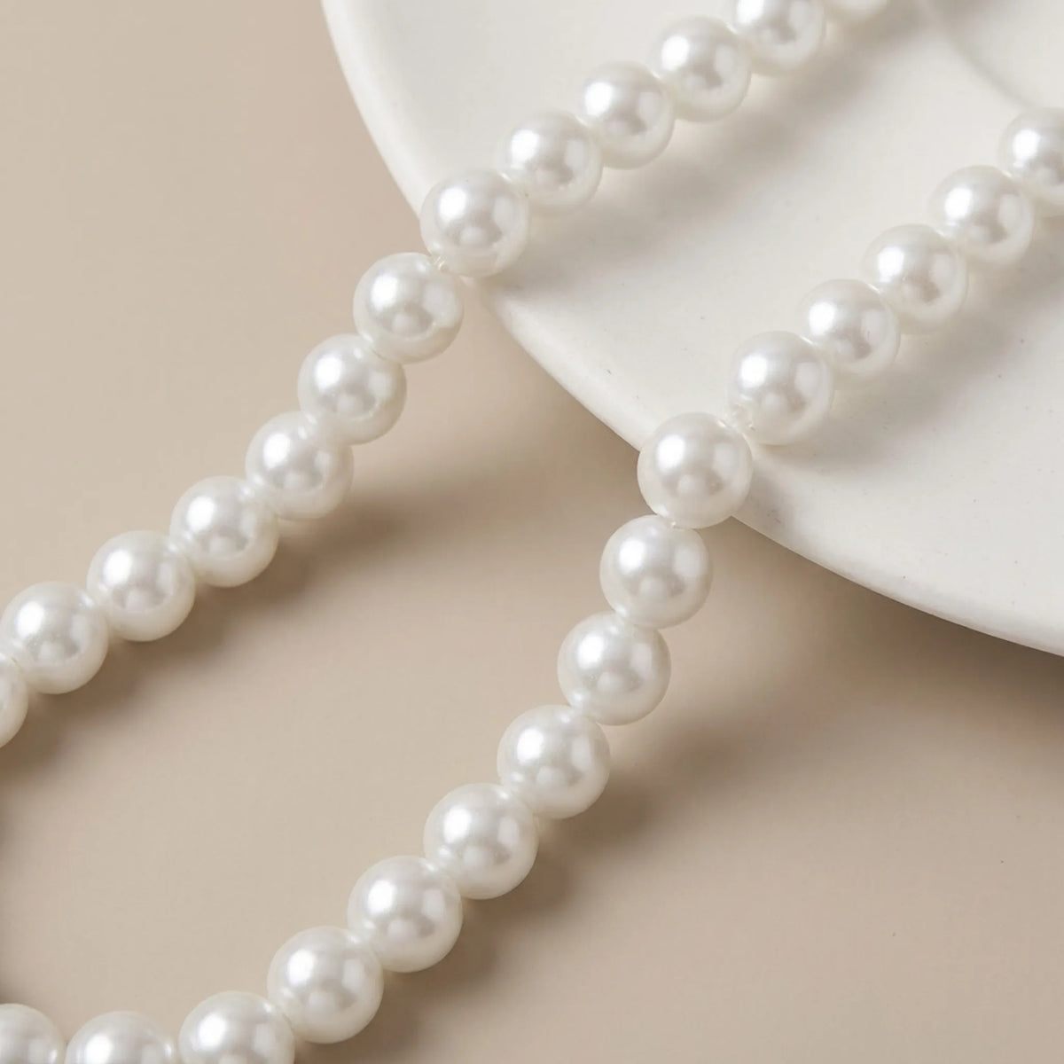 Close up of white glass pearl round beads