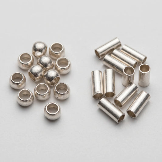Round crimp beads and crimp tubes compared before crimping