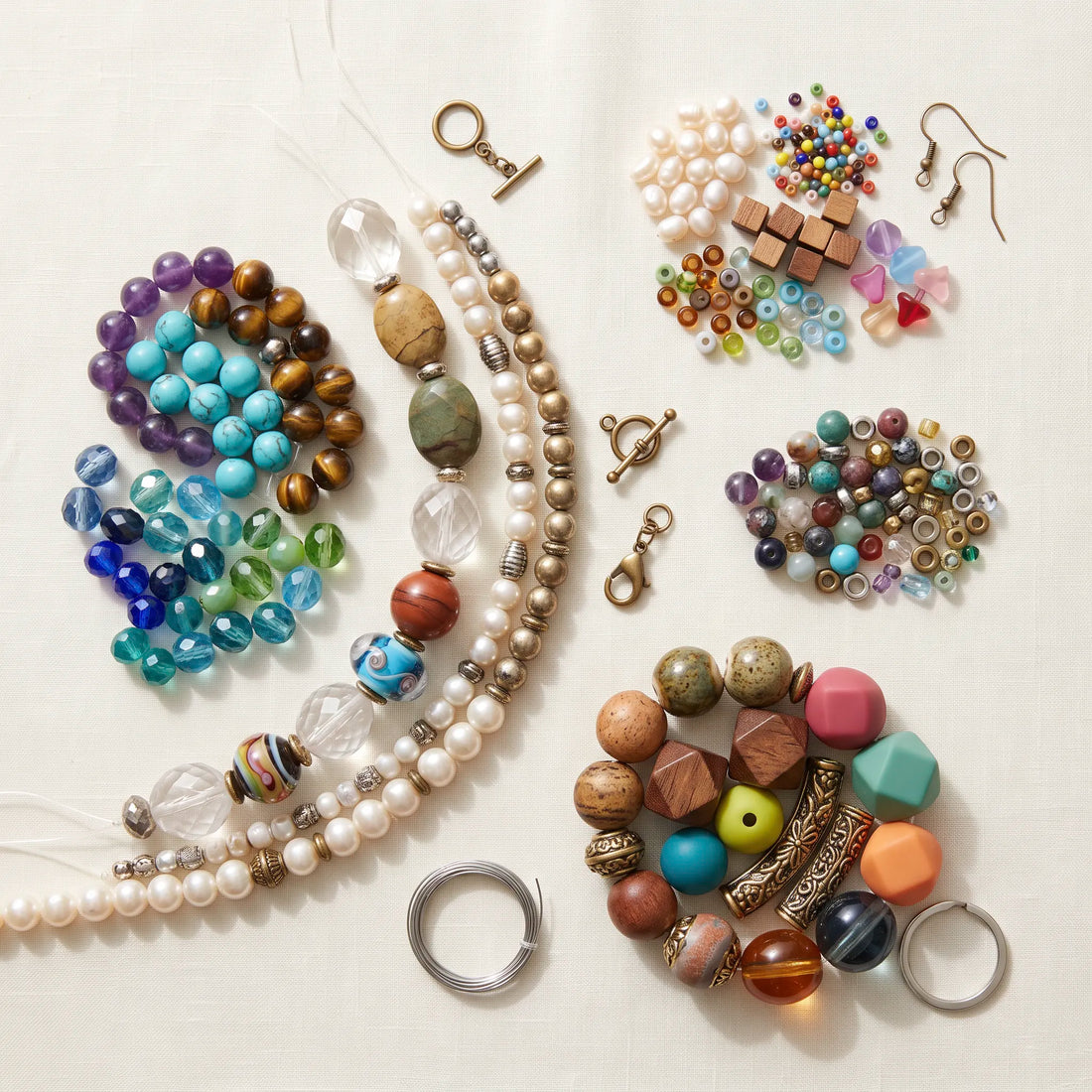 Different types of beads selected for bracelets, necklaces, earrings, anklets, and keychains