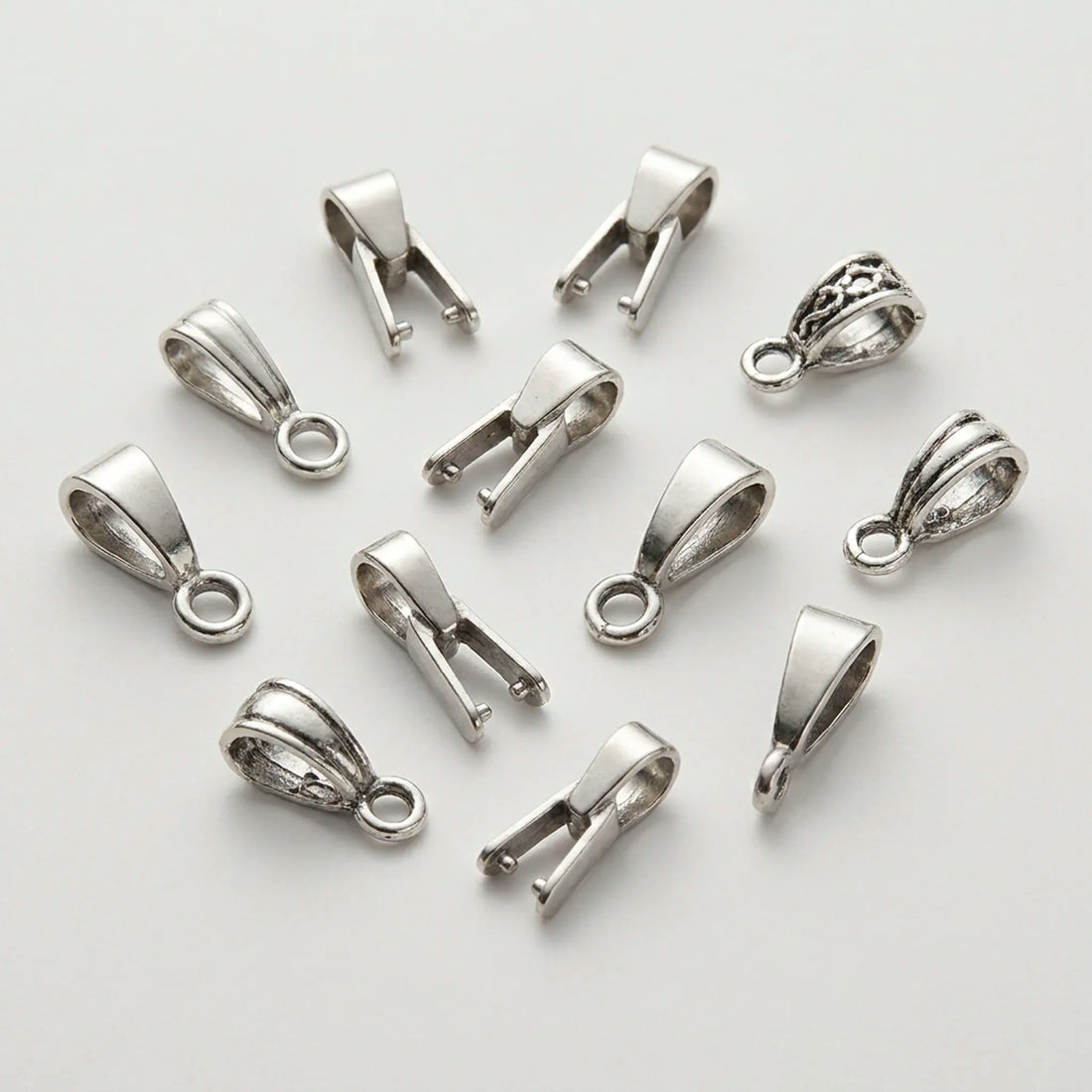 Different types of jewelry bails for attaching pendants to necklaces
