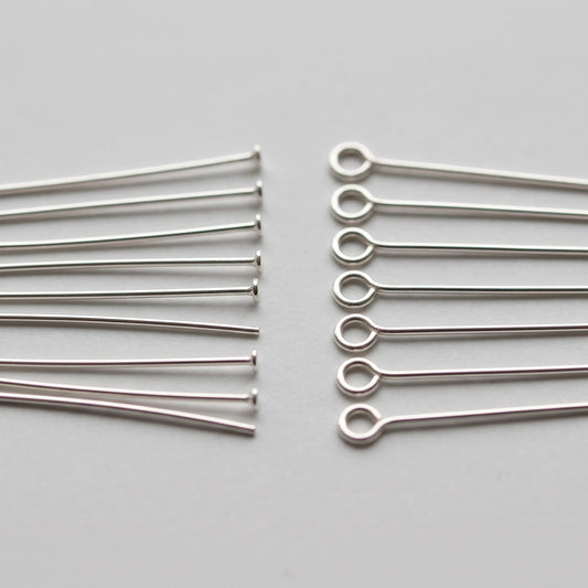 Head pins and eye pins for jewelry making shown side by side