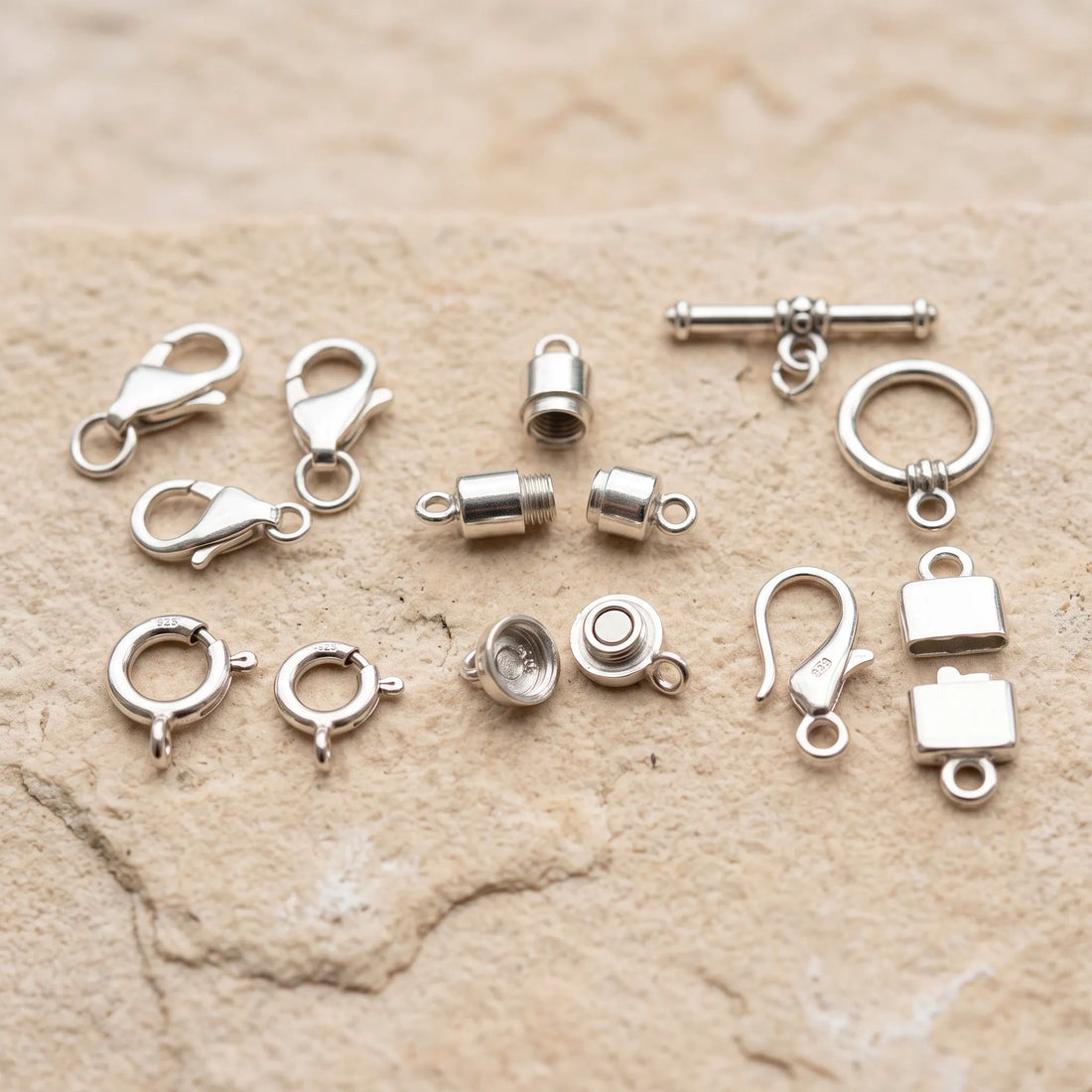 Different types of sterling silver clasps for jewelry making including lobster spring ring toggle barrel and magnetic clasps