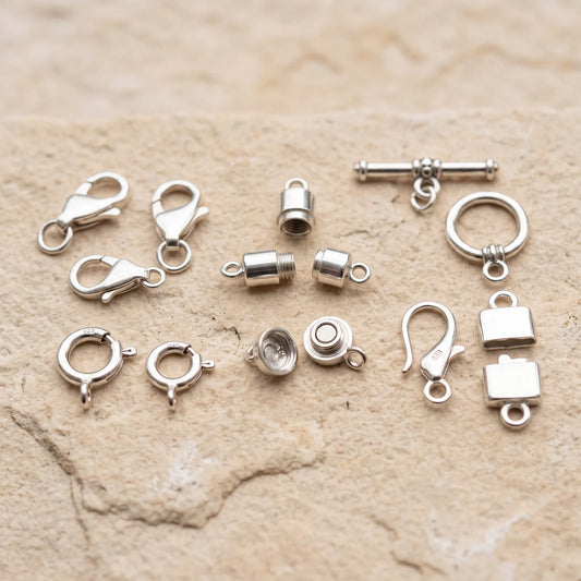 Different types of sterling silver clasps for jewelry making including lobster spring ring toggle barrel and magnetic clasps