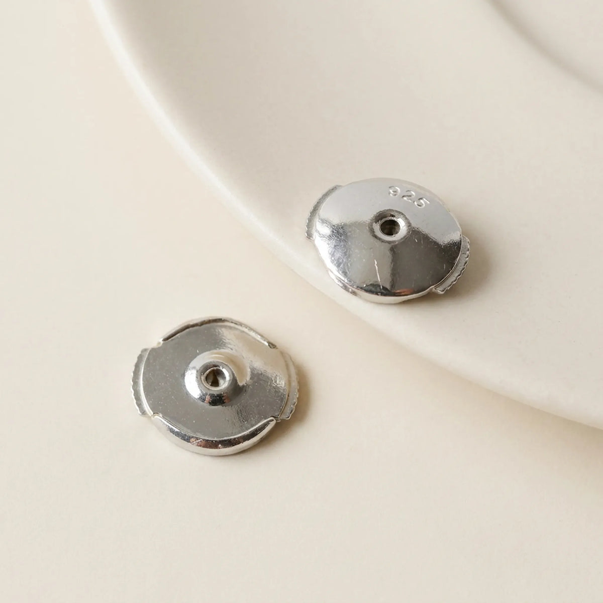 925 silver earring backs for stud earrings shown from both sides