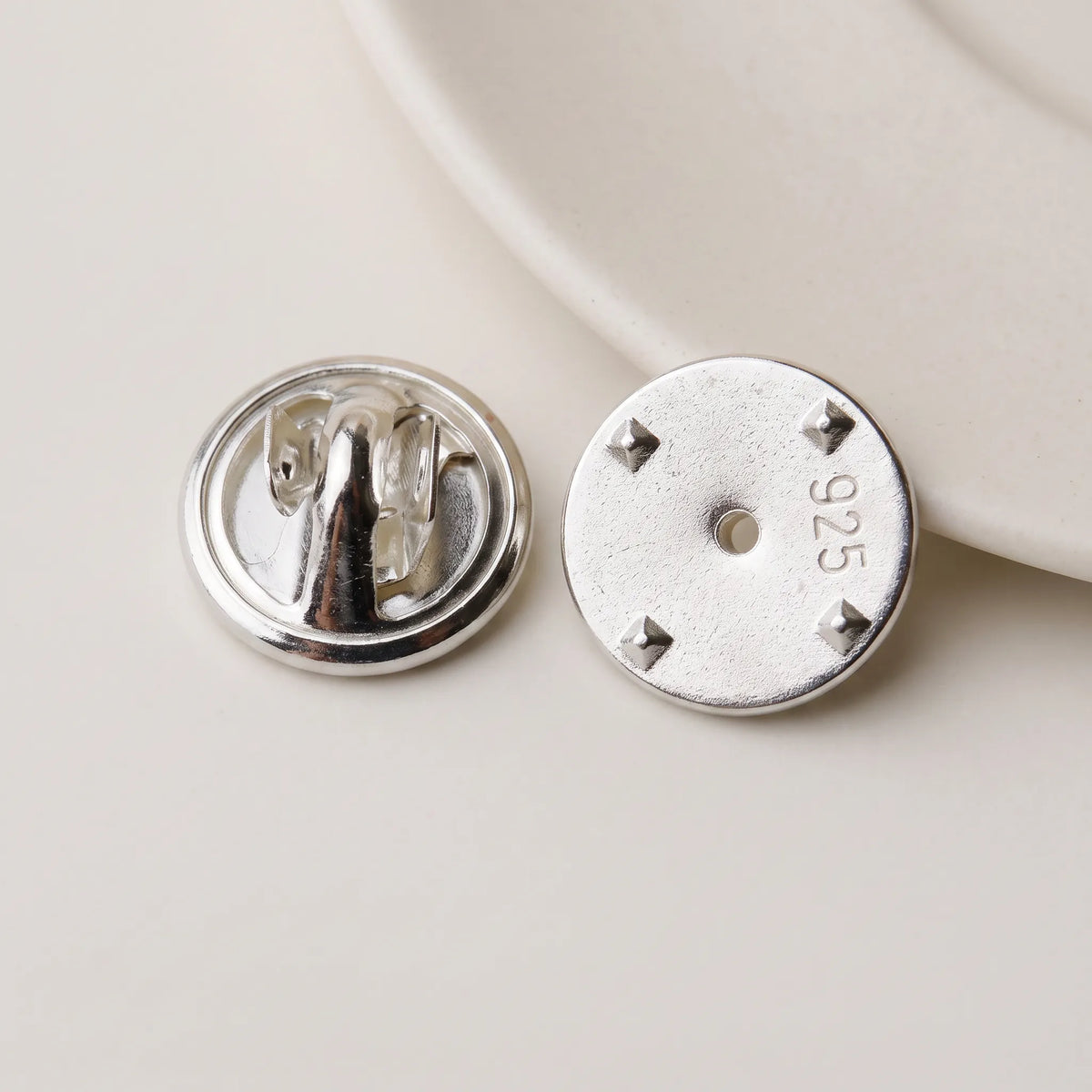925 sterling silver locking pin back shown from front and back with 925 hallmark