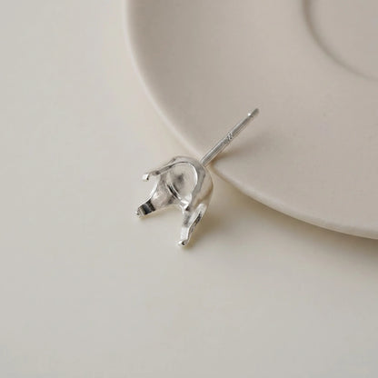 Side view of 925 sterling silver 4-prong snap-in stud earring setting with post