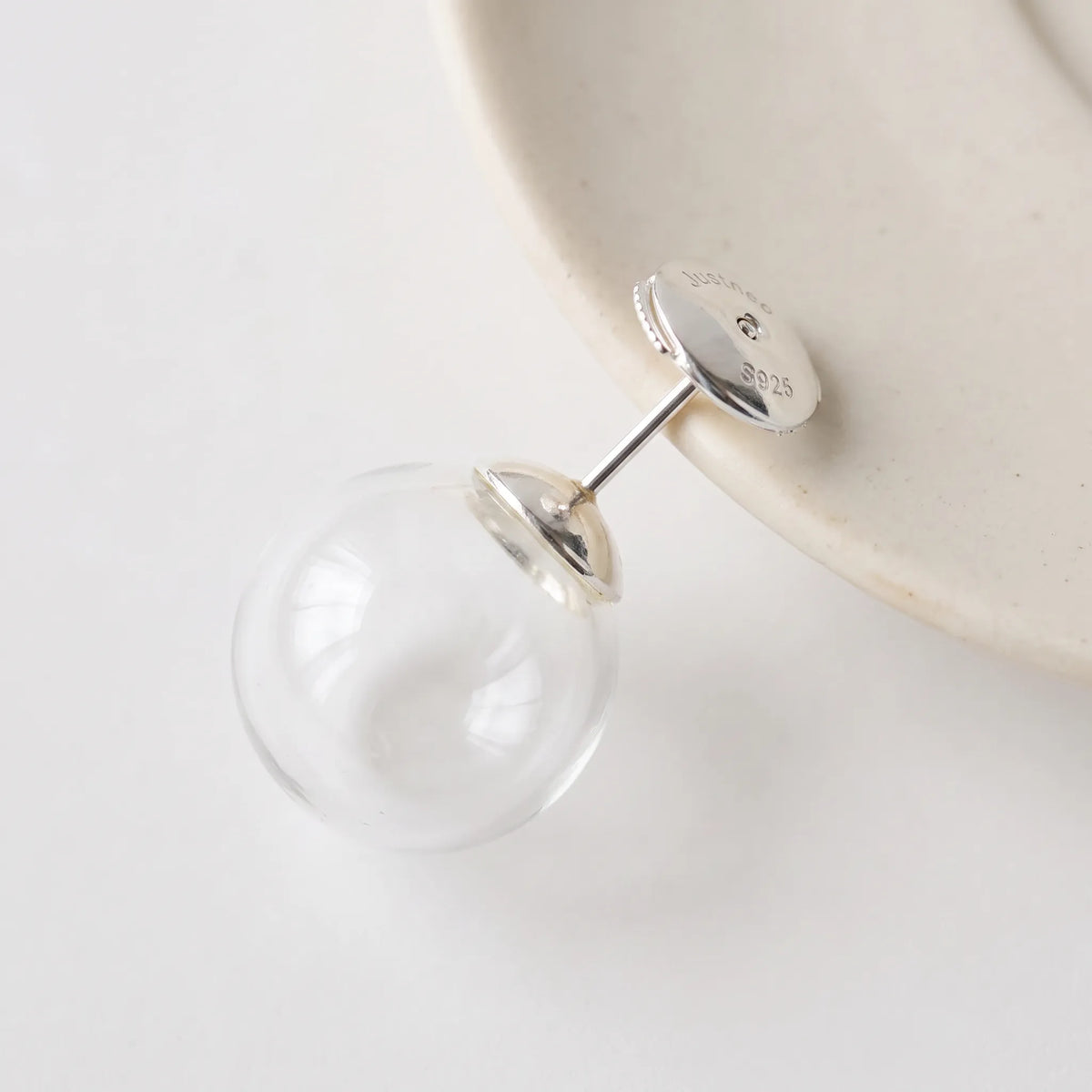925 sterling silver earring back secured on a stud earrin
