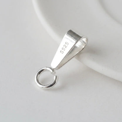 Close-up of 925 sterling silver pendant bail with open jump ring and S925 hallmark
