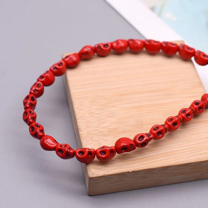 Rote Howlith-Totenkopfperlen, 12x13mm