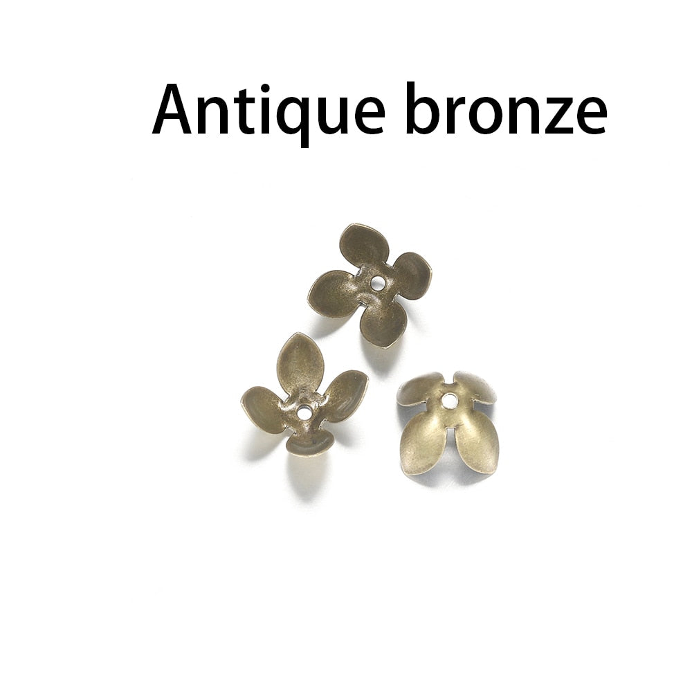 15 x 8 mm vergoldete Perlenkappen mit vier Blättern, 50 Stück