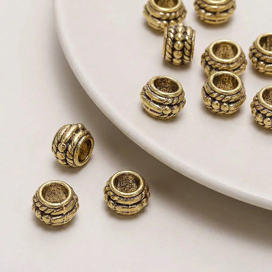 Antique gold decorative barrel spacer beads