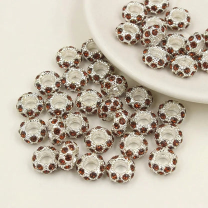 Brown rhinestone spacer beads with large holes and silver tone finish