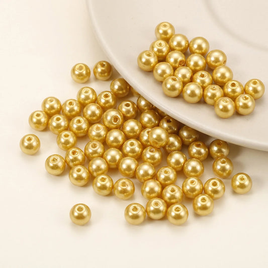 Champagne glass pearl beads with pearl coating and visible bead holes