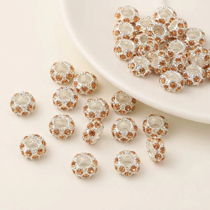 Champagne rhinestone spacer beads with large holes and silver tone finish
