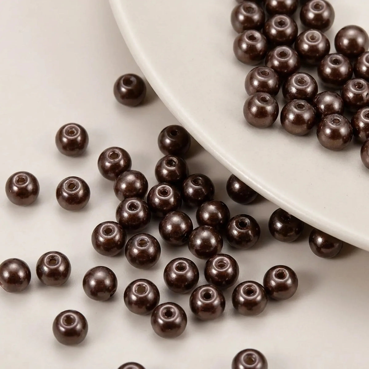 Close-up of chocolate glass pearl beads with smooth pearl finish