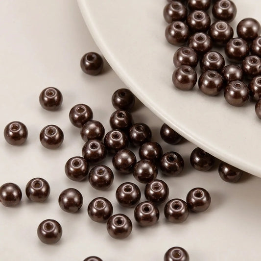 Close-up of chocolate glass pearl beads with smooth pearl finish