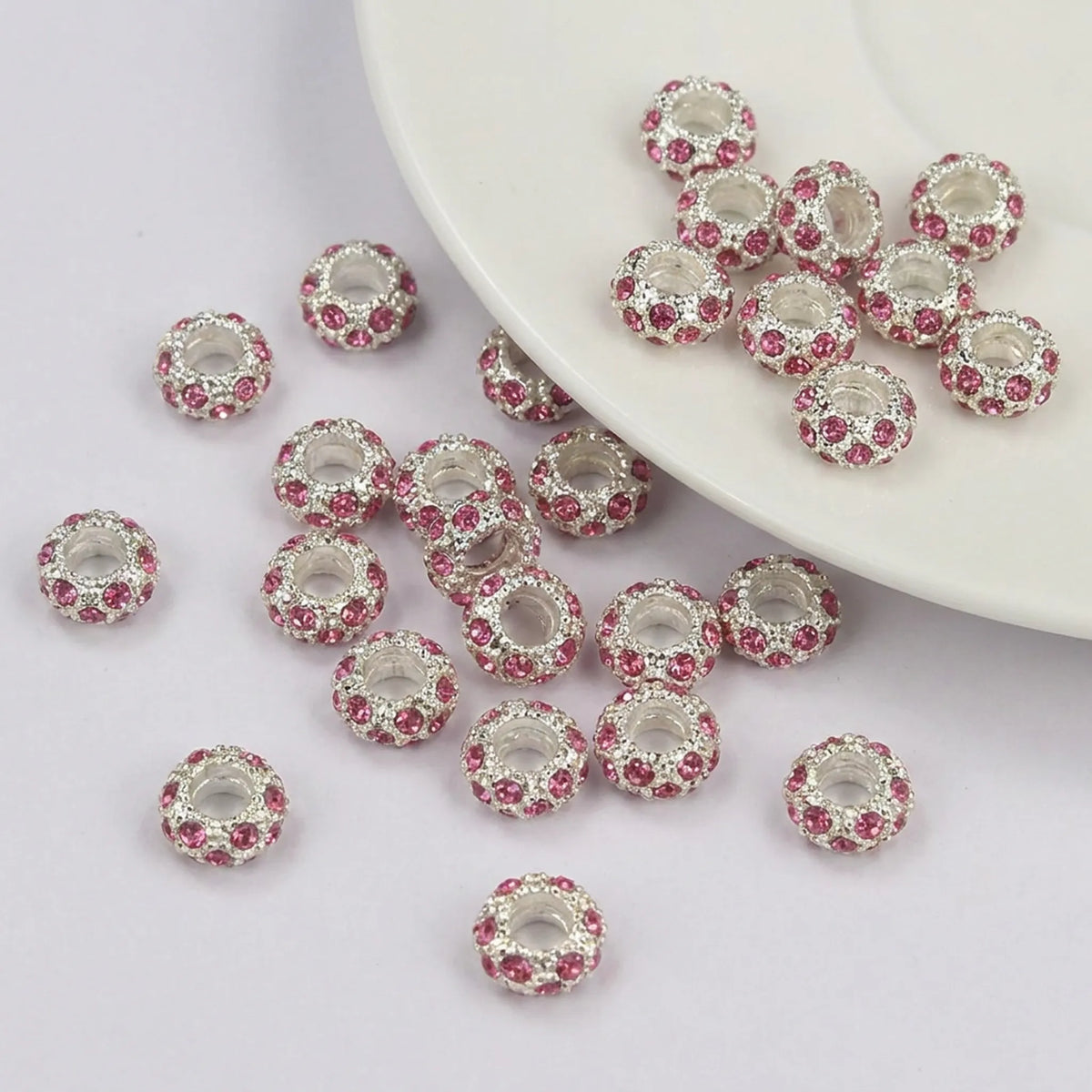 Rose pink crystal rhinestone rondelle spacer beads 10mm with silver tone finish