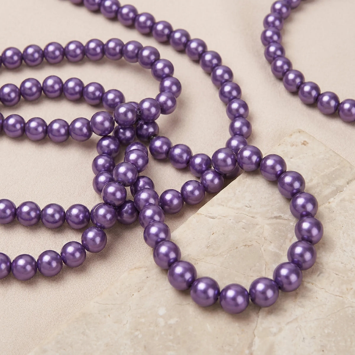 Dark purple glass pearl beads used in jewelry making designs