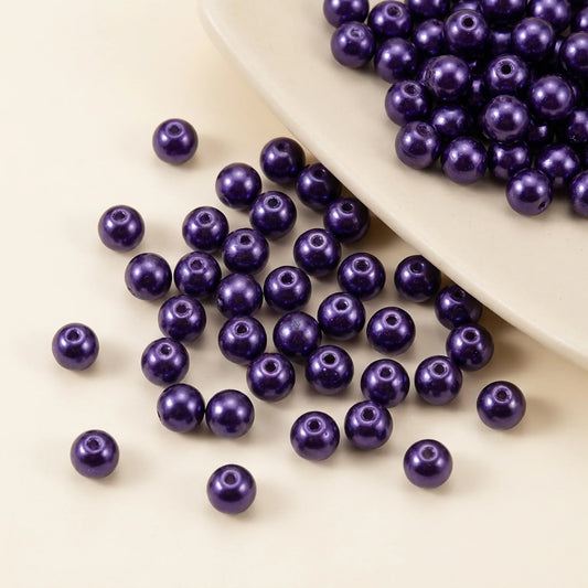 Dark purple glass pearl beads with pearl coating and visible bead holes