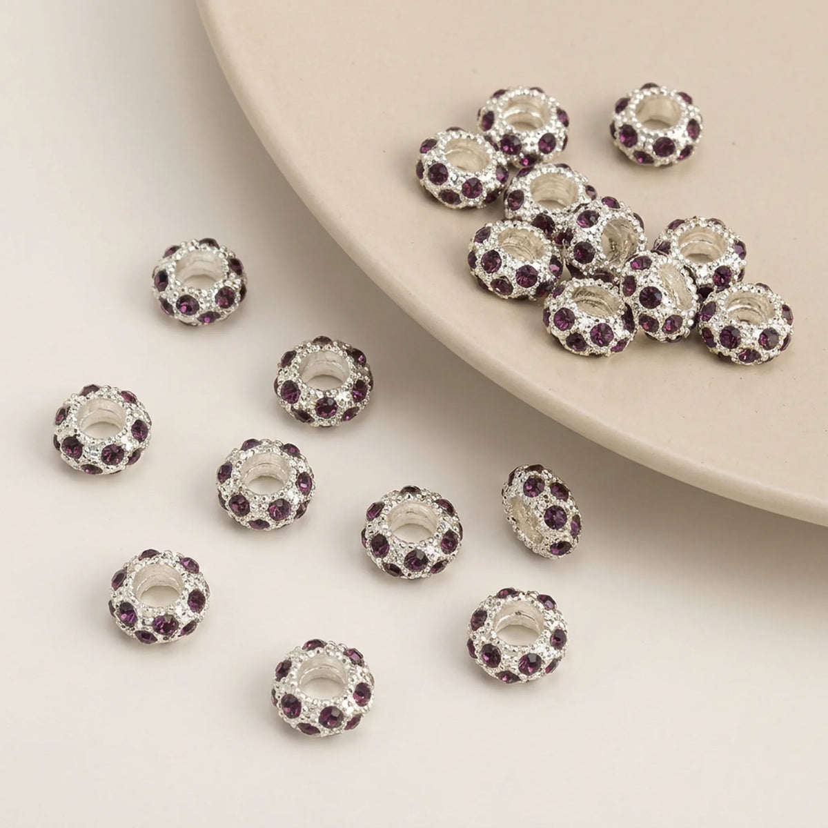 Dark purple rhinestone spacer beads with large holes and silver tone finish
