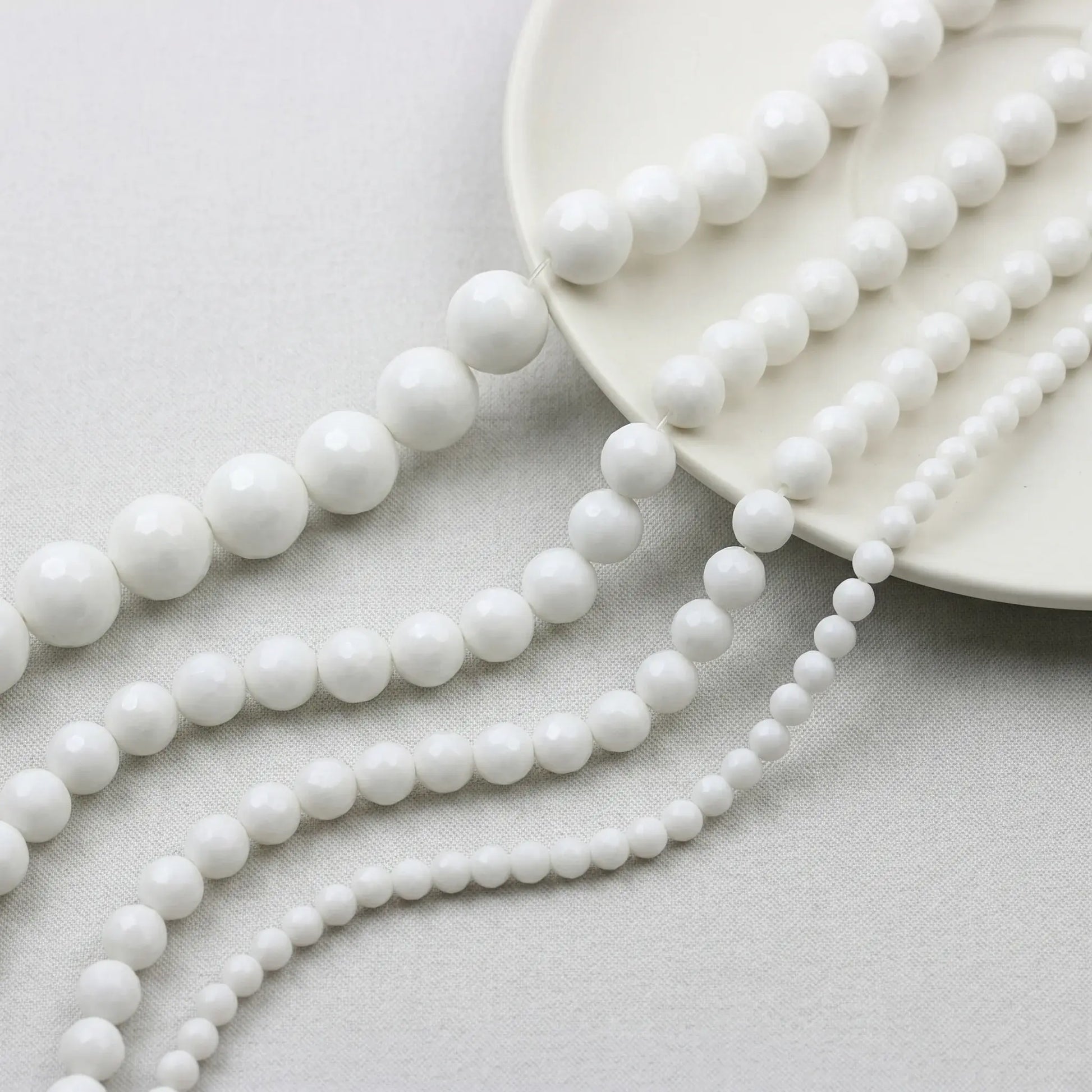 Faceted white alabaster beads round natural stone strand