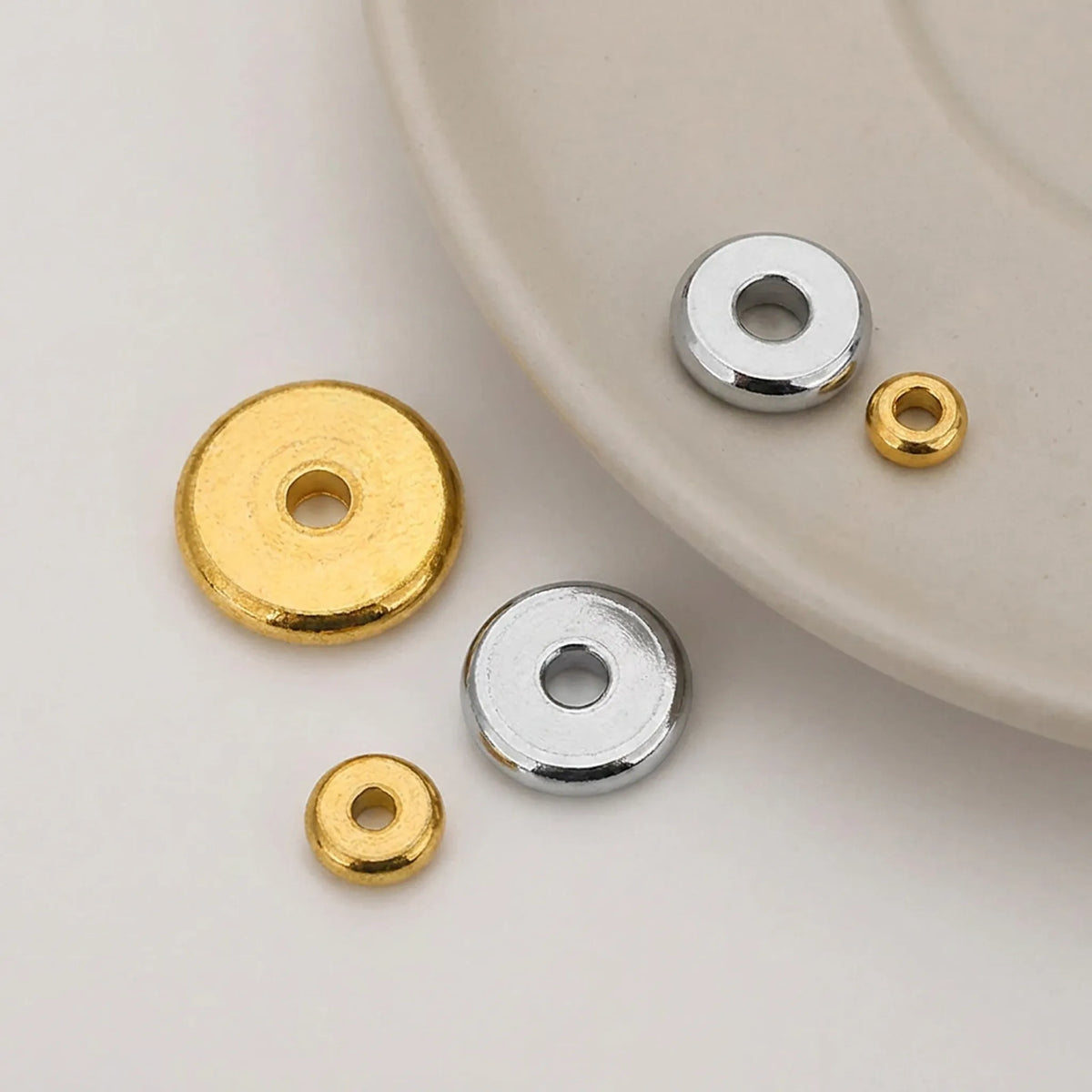 Close up of 304 stainless steel flat round spacer beads