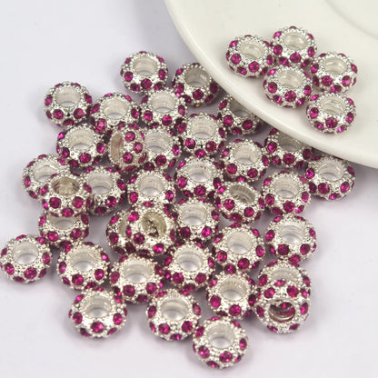 Fuchsia rhinestone spacer beads with large holes and silver tone finish
