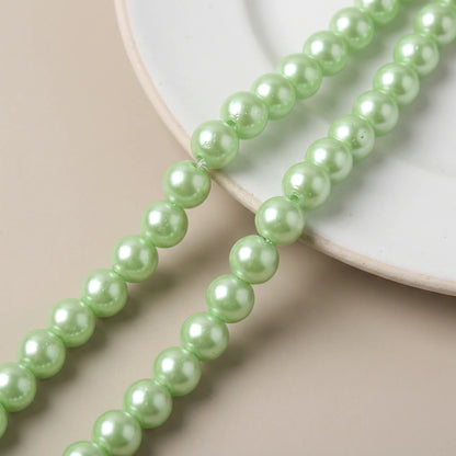 Close up of green glass pearl round beads
