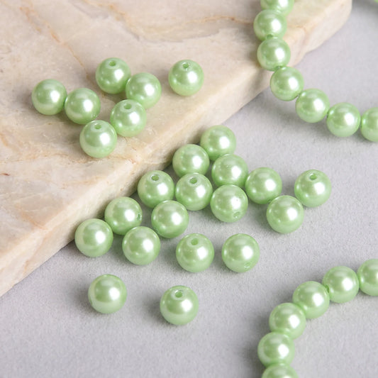 Green glass pearl round beads used in a handmade necklace