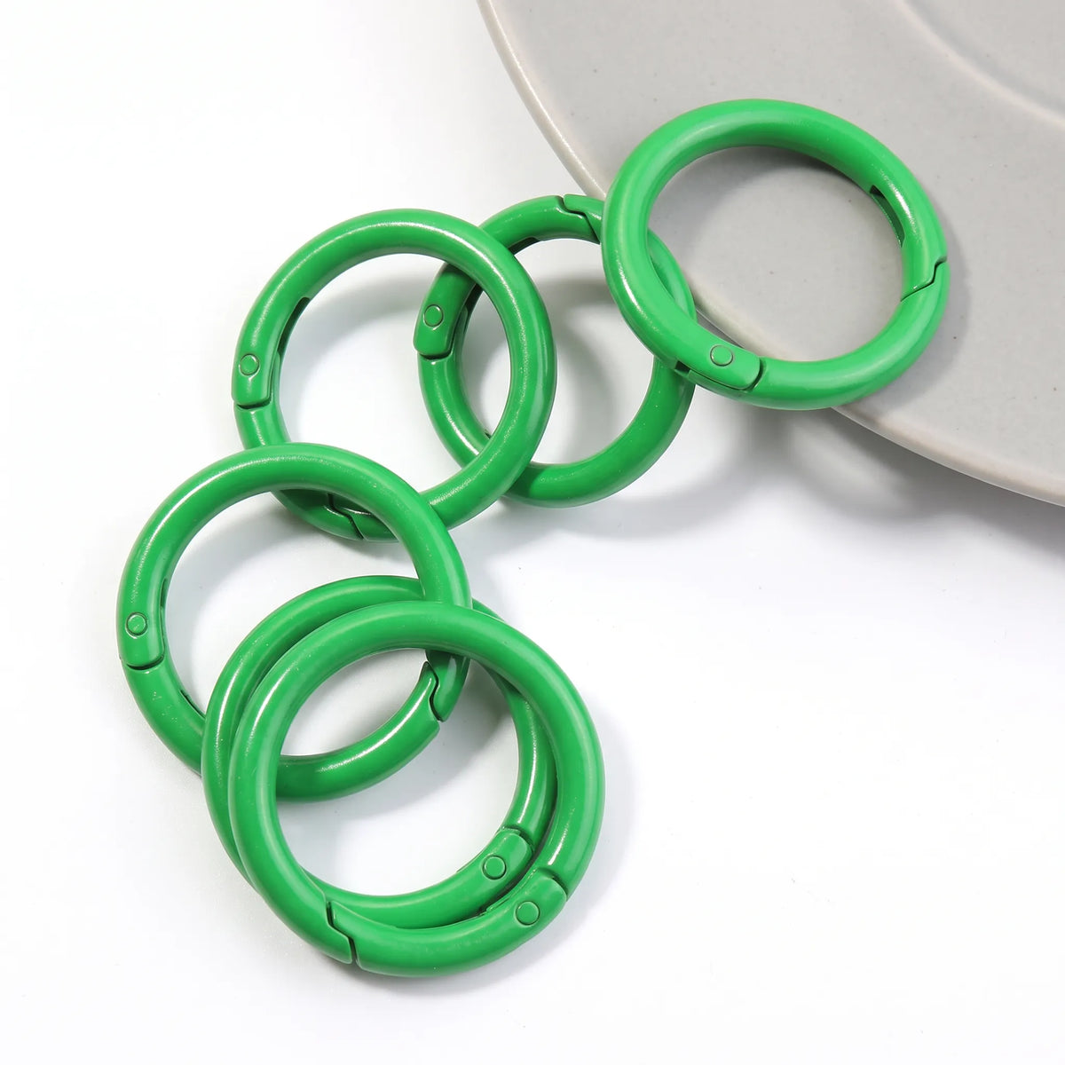 Green metal round carabiner clasps for keychains and DIY crafts