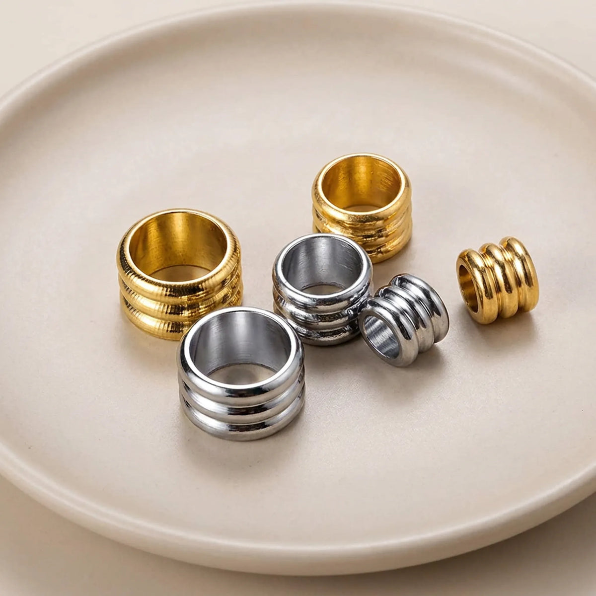 Close up of grooved large hole tube spacer beads