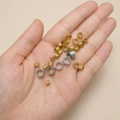 Large hole tube spacer beads shown in hand for size comparison