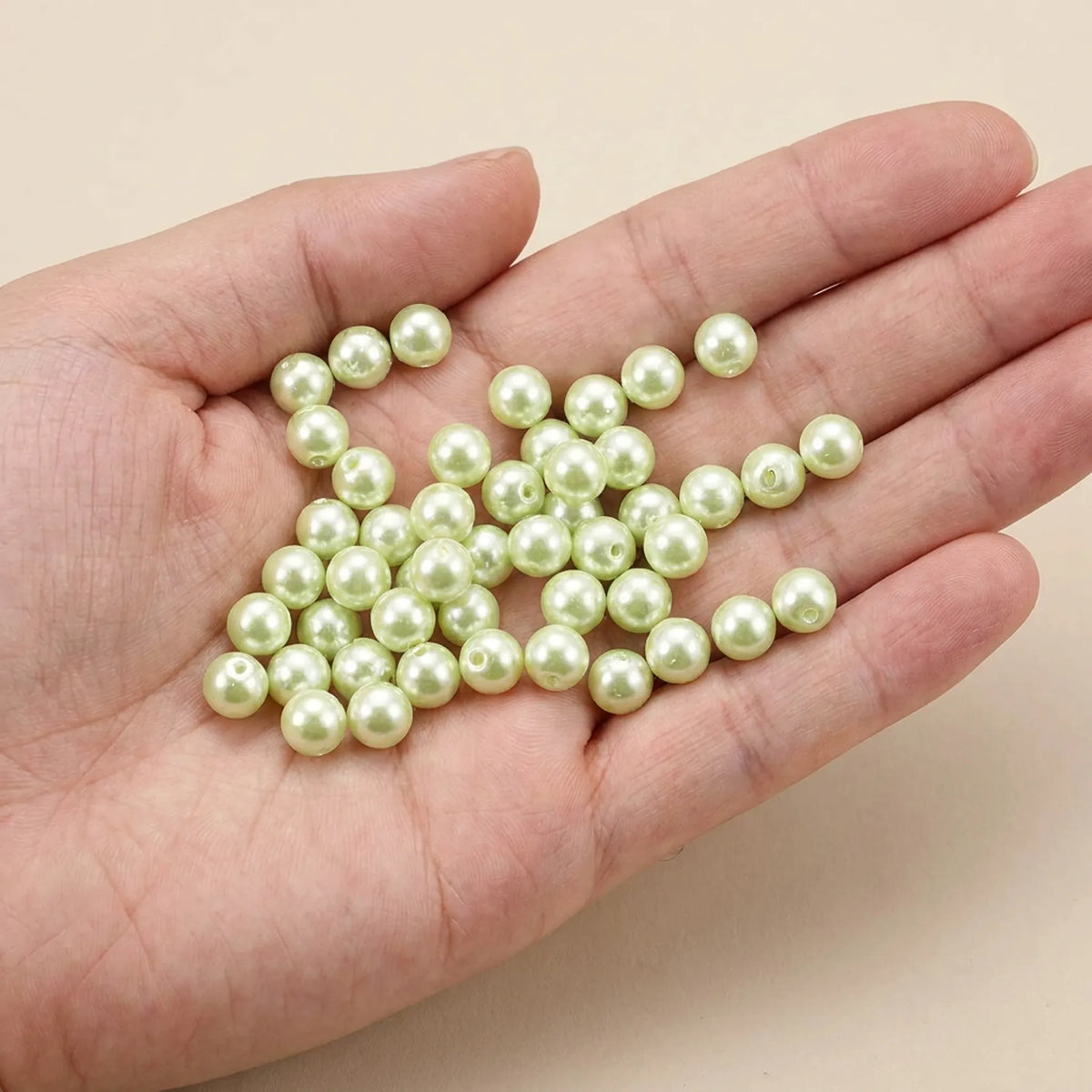Light Green Czech Glass Pearl Beads Round Loose Glass Beads Shown in Hand for Size Reference