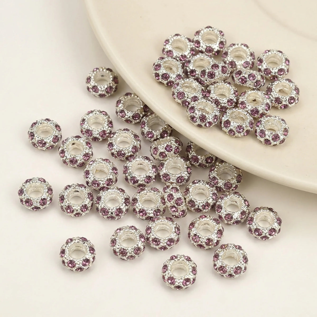 Light purple rhinestone spacer beads with large holes and silver tone finish