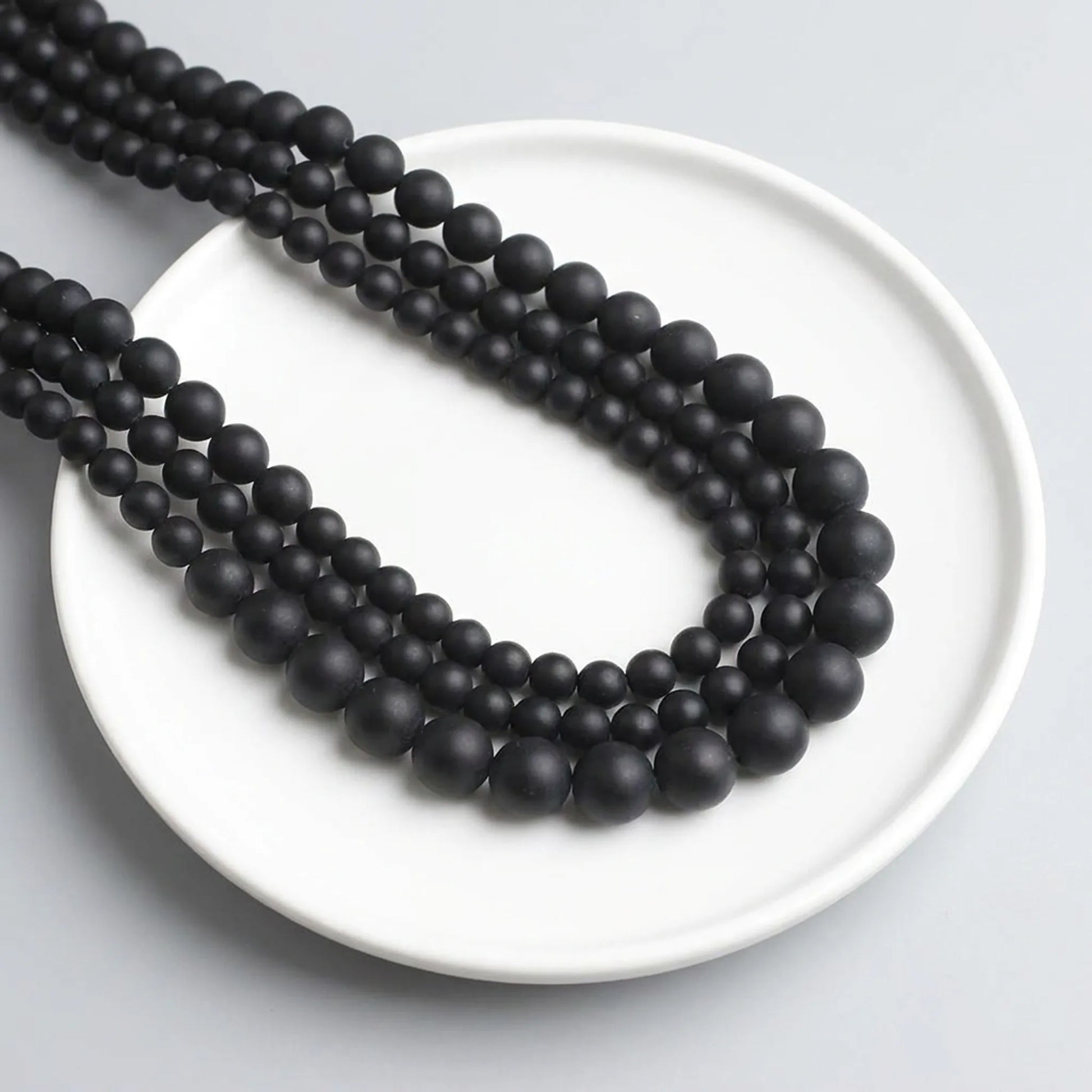 Matte black onyx beads round stone strand