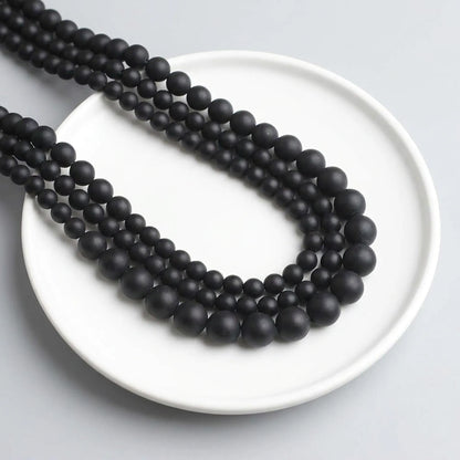 Matte black onyx beads round stone strand