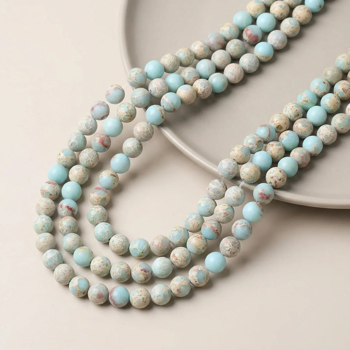 Matte Shoushan stone round beads in mixed light blue, cream and pink tones