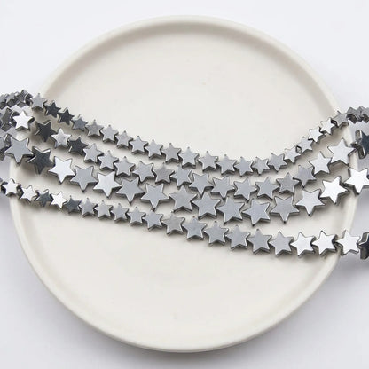 Metallic silver star hematite beads close up