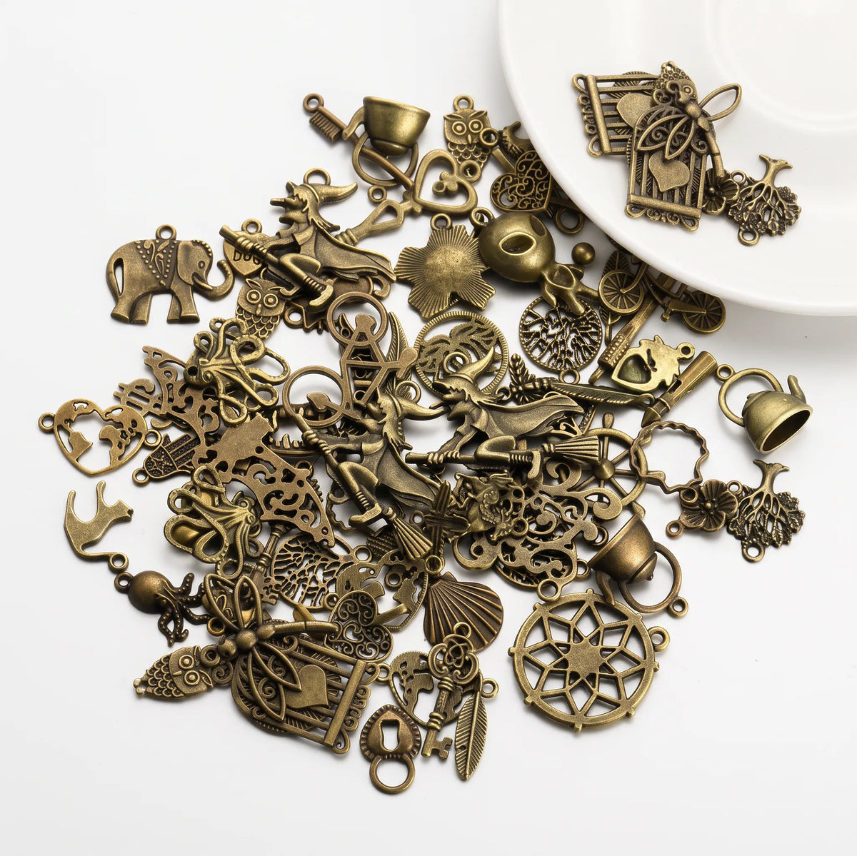 Mixed antique bronze tone charms with animals hearts flowers leaves and decorative motifs