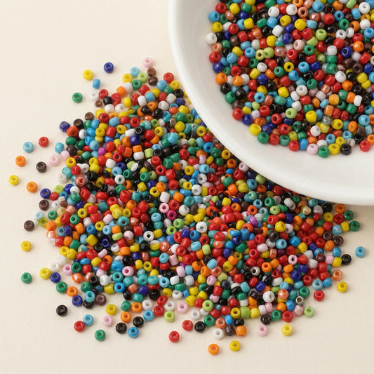Mixed opaque 2mm glass seed beads shown in hand assorted colorful seed beads for jewelry making