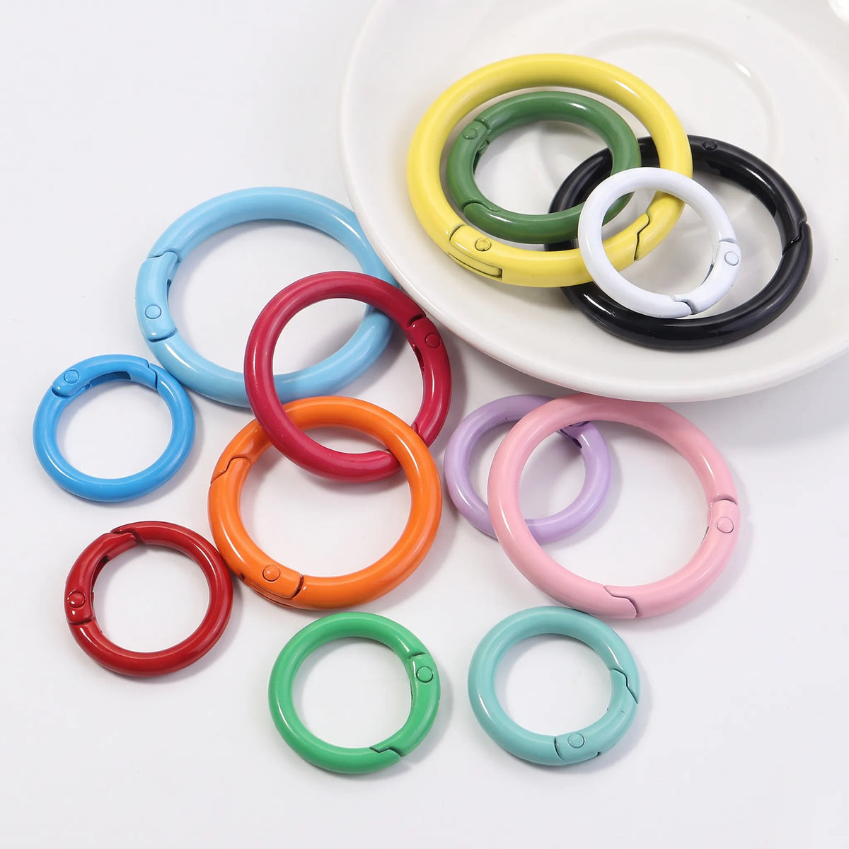 Assorted multicolor metal round carabiner clasps in different sizes