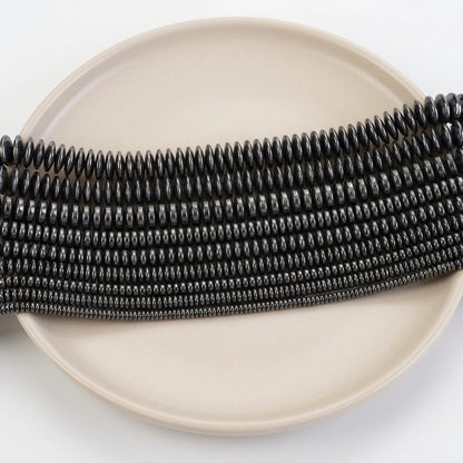 Natural hematite flat rondelle beads in assorted sizes with smooth black metallic finish