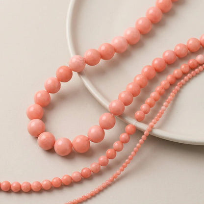 Natural pink coral round beads in 4mm, 6mm, 8mm and 10mm sizes for jewelry making