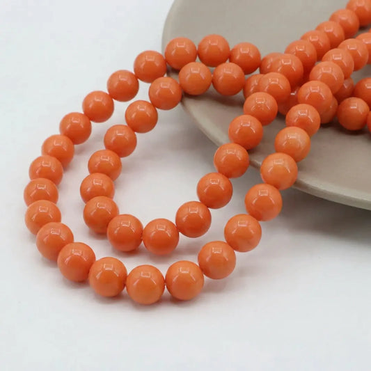 Orange coated opaque glass round beads for jewelry making