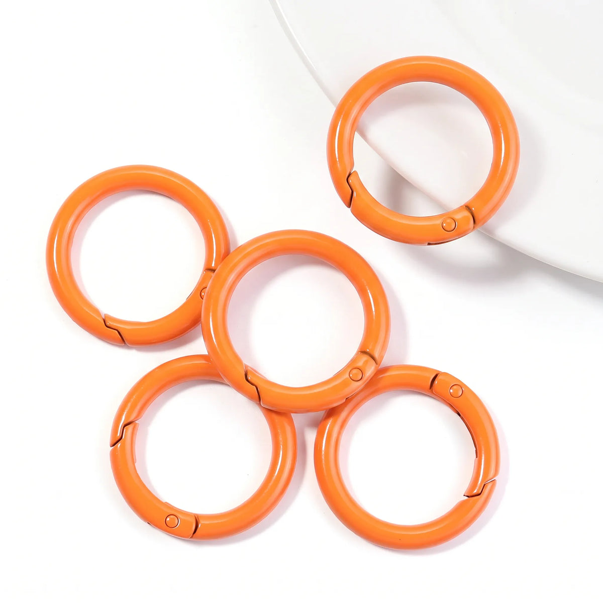 Orange metal round carabiner clasps with openable spring mechanism