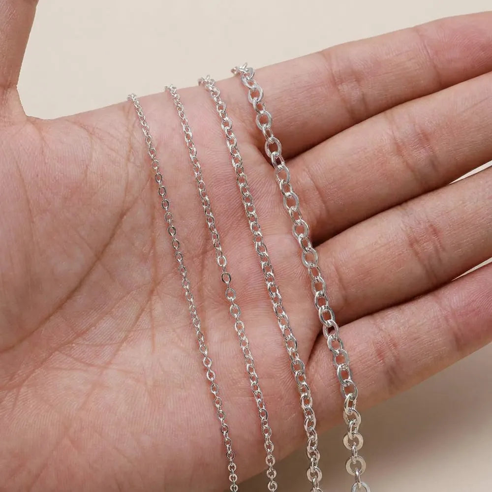 Oval link necklace chain shown in hand for size comparison